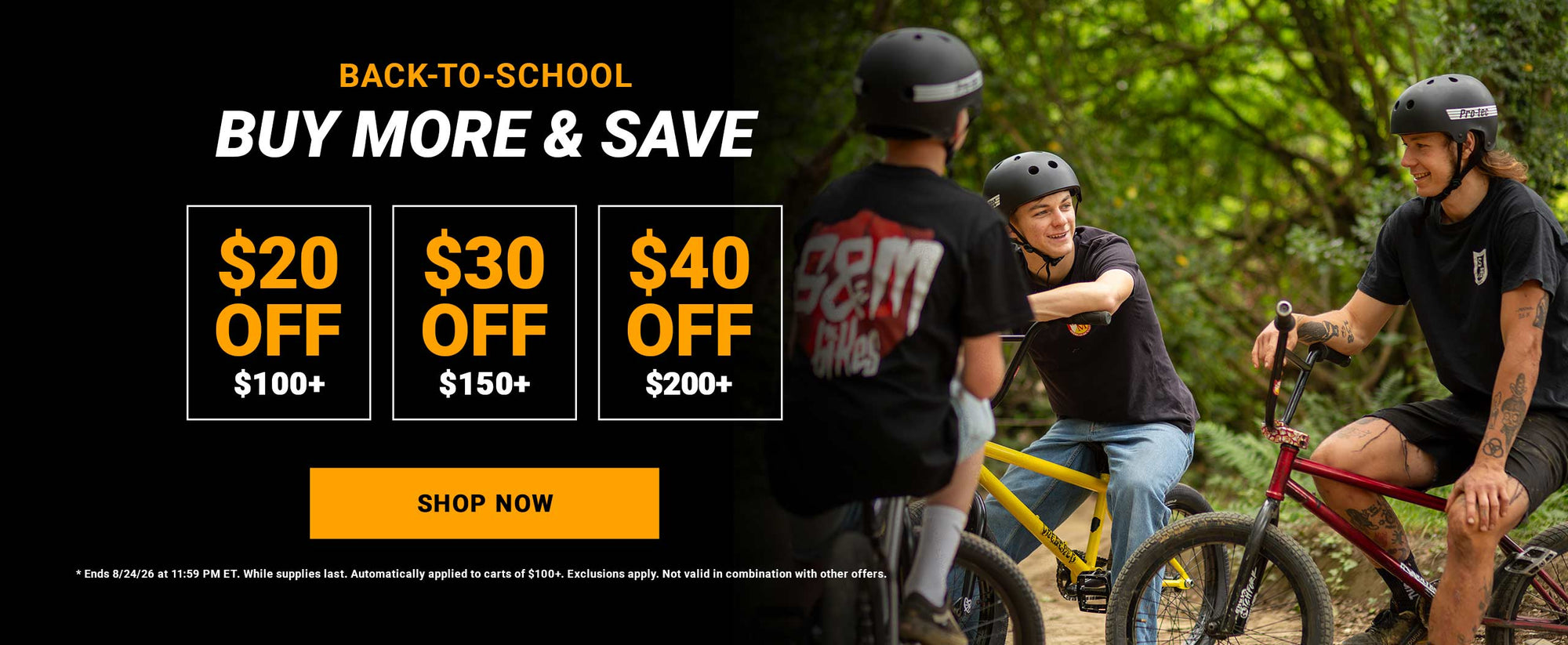 Promotional banner for back-to-school cycling deals with three riders on bicycles outdoors on a wooded path. Large text reads 'BACK TO SCHOOL BUY MORE & SAVE' with discount boxes '$20 OFF $100+', '$30 OFF $150+', '$40 OFF $200+', and a yellow 'SHOP NOW' button.